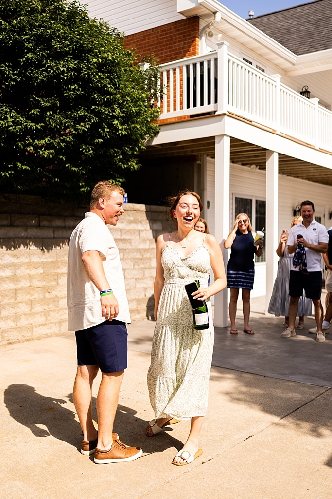 Groom to be proposing during surprise wedding proposal at family home | Emotional reaction during surprise wedding proposal at family home in Missouri | Couple celebrating after surprise wedding proposal at family home | Portraits of newly engaged couple after surprise wedding proposal